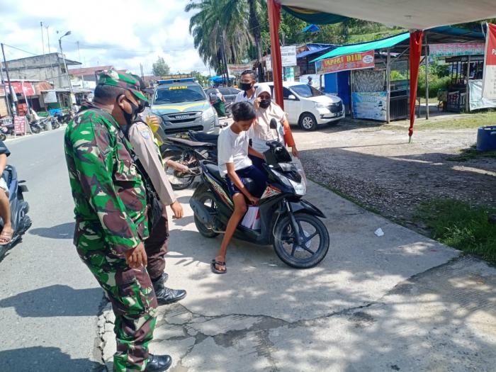 Anggota Danramil 09/Minas Kembali gelar gakplin protokol kesehatan.