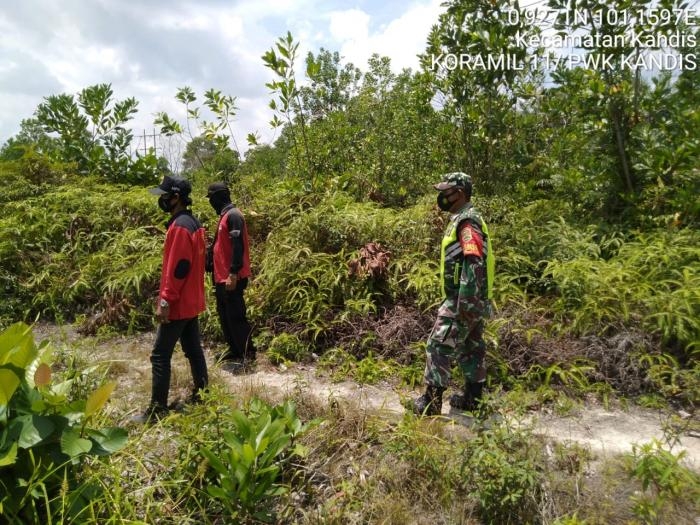 Cegah Kebakaran, Anggota Koramil 11 Kandis Serda Sutikno Giat Lakukan Patroli Karlahut
