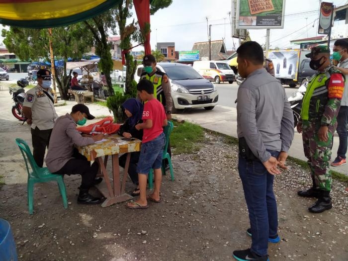 Putus Covid 19, Anggota Koramil 9 Minas Gelar Operasi Prokes