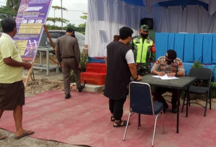 Sertu Ardhi Syam Kembali Terapkan Prokes dalam Operasi Yustisi di Kelurahan Minas Jaya