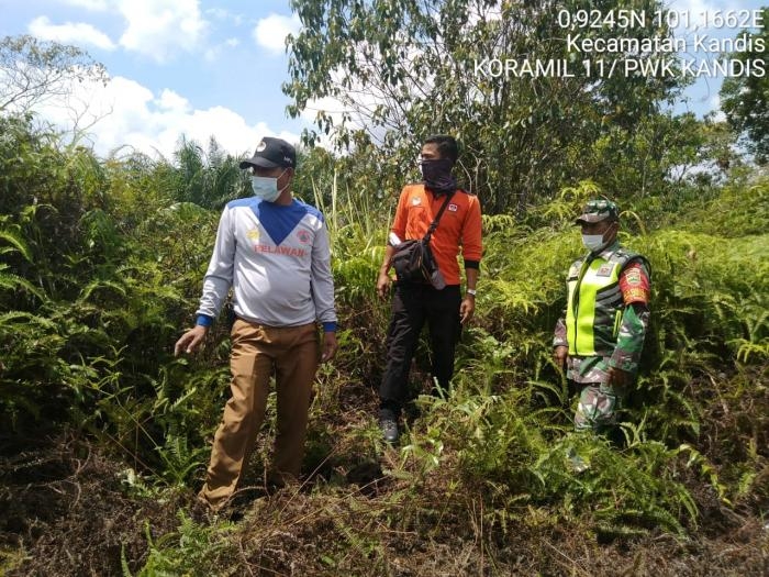 Cegah Kebakaran Lahan, Anggota Koramil 11 Kandis Serda Sutikno Gelar Patroli Karlahut