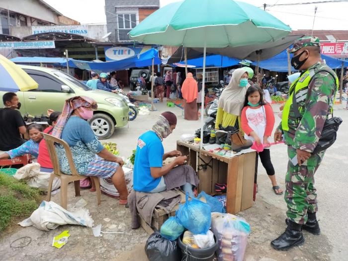 Anggota Danramil 09/Minas Kembali gelar gakplin protokol kesehatan.