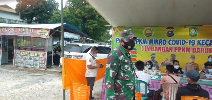 Serma Zulkifli Terapkan Aturan Prokes Dalam Operasi Yustisi di Kelurahan Minas